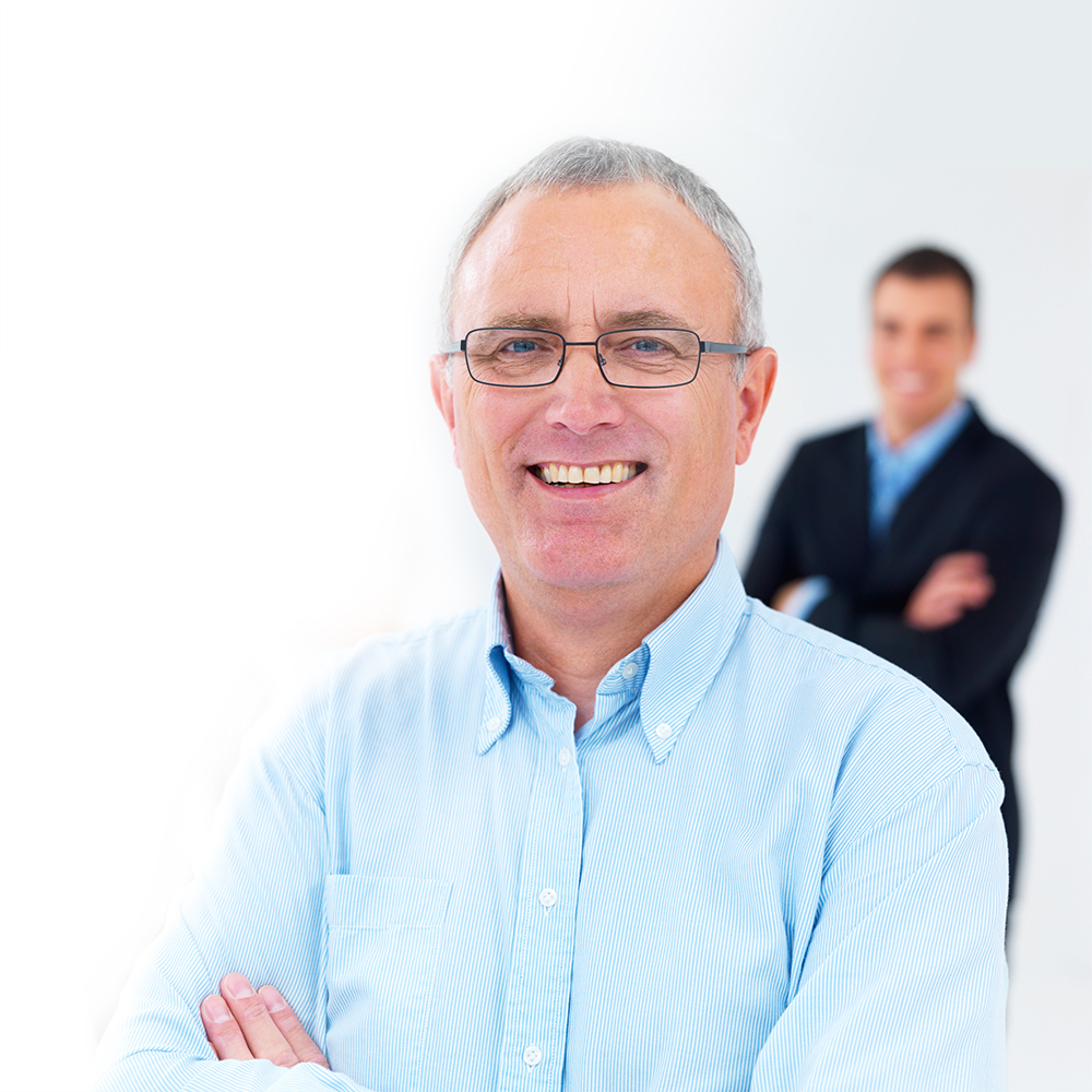 Professional advisor helping business owner plan succession strategy